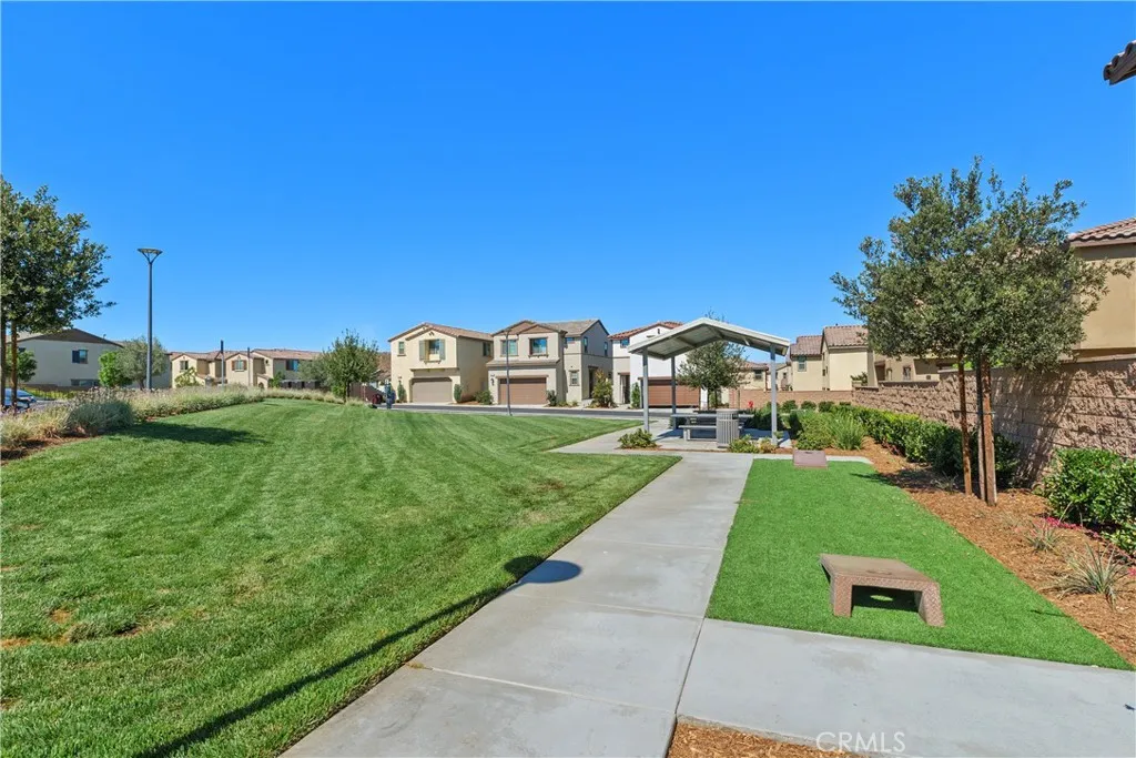 Two doors down has small park area with corn hole and covered picnic tables.