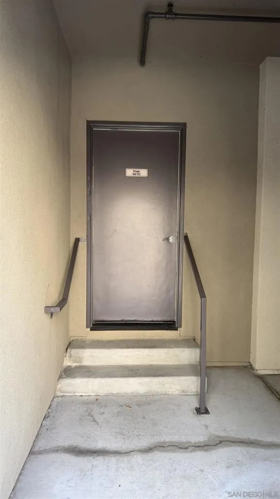 back entrance located near both one car garages