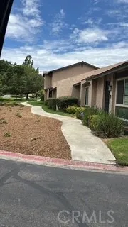 Front entrance with walkway to park area