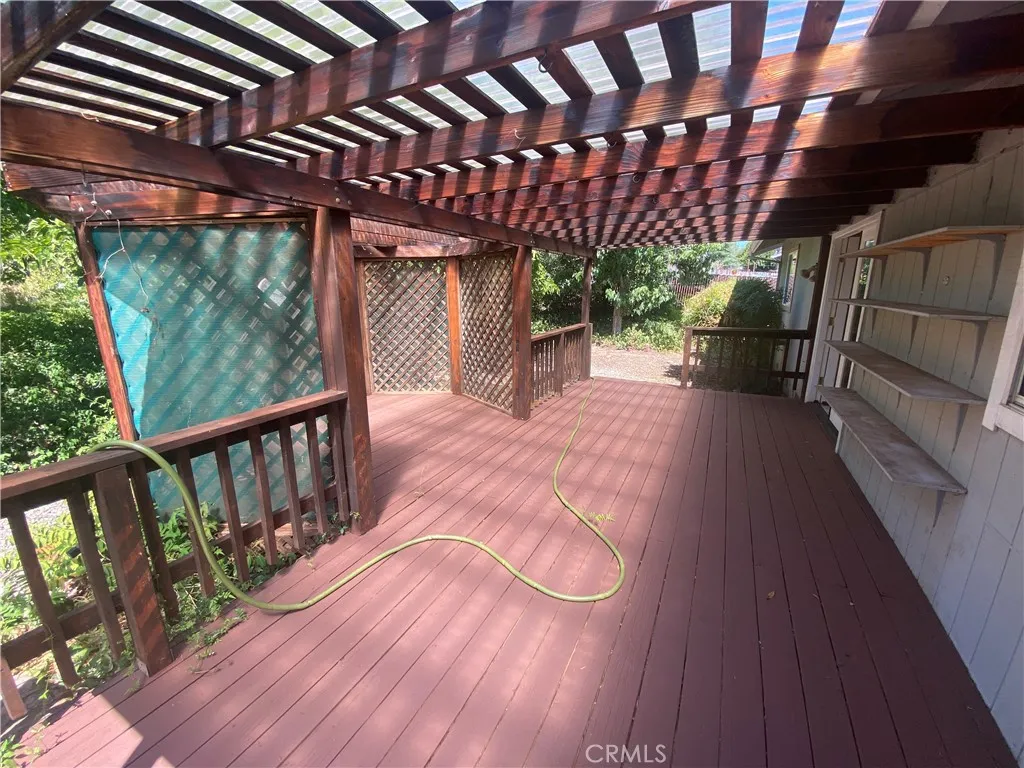 Covered deck in backyard. Covered deck in backyard.