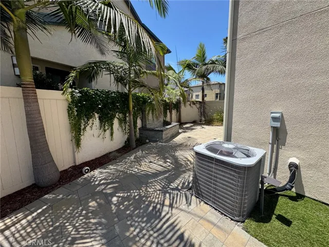 Second patio area leading to the guest bedroom sliding glass door  (virtually staged with AI)