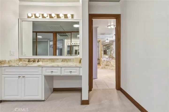 Cosmetic vanity area + sink in the dressing room