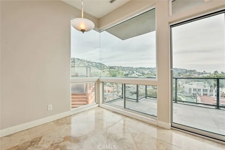 Dining area with city lights and ocean views.