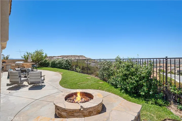 Exterior fire pit area overlooking the view
