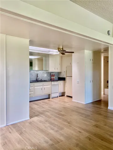 FROM THE ENTRY DOOR TOWARDS THE KITCHEN
