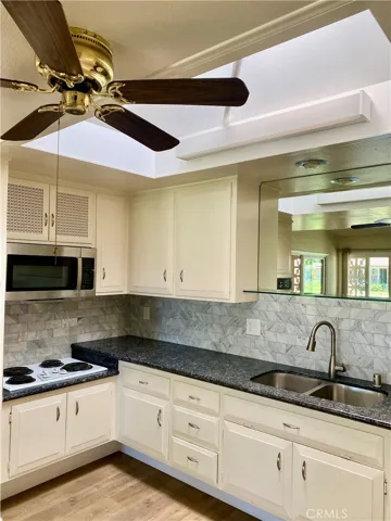 KITCHEN CEILING FAN AND LARGE SKYLIGHT