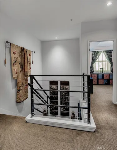 Open upper level landing overlooking the contemporary staircase.