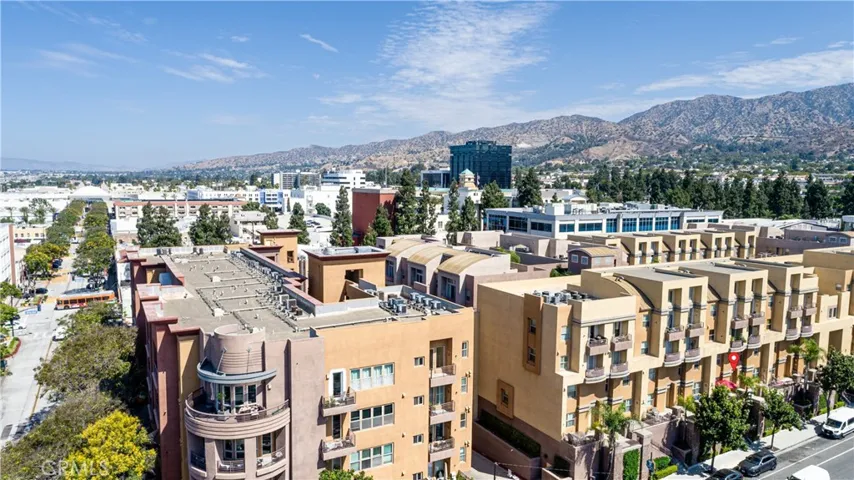 Wide aerial view showcasing the community's central Burbank setting and mountain backdrop.