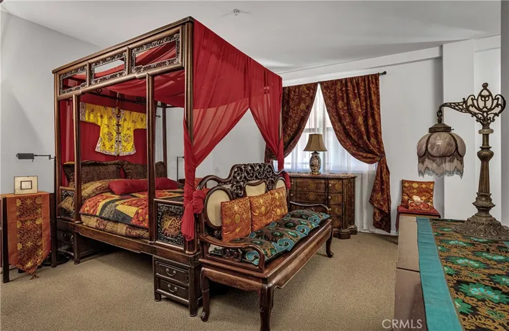 Generously sized primary suite with abundant space for a sitting area and additional furnishings.