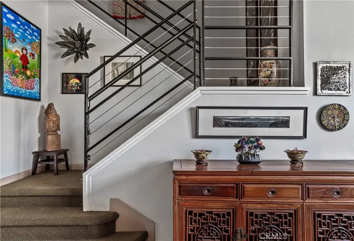 Contemporary staircase with modern horizontal railing connecting the home's two levels.