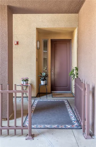 Private entrance opens to a sheltered courtyard side patio.