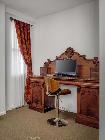 Primary suite includes a useful niche suitable for a desk, vanity, or reading area.