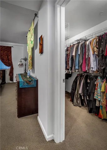 Generous walk-in closet offering substantial hanging and storage space.