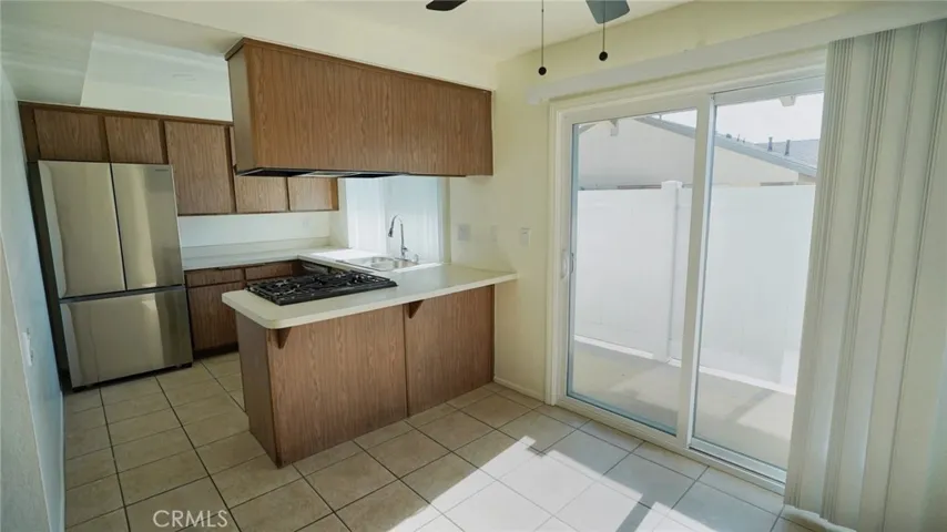 Kitchen and eating area. Entrance to balcony