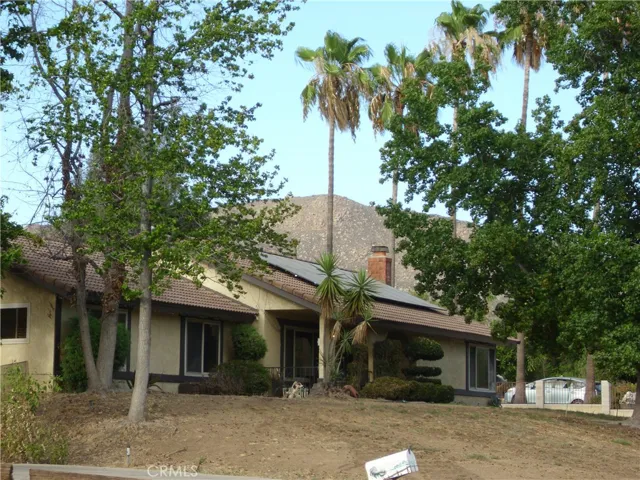 Mature landscaping and sweeping mountain views.