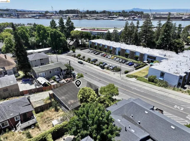 Aerial perspective showcasing a residential property with surrounding neighborhood features