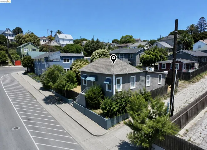 Single-story residence featuring grey siding and a shingle roof