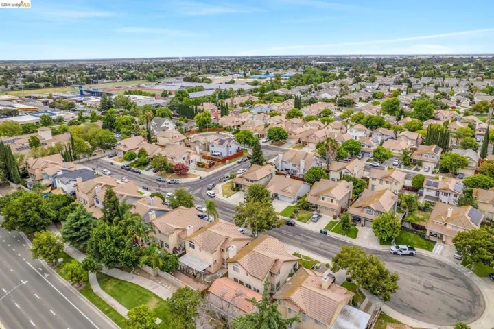 Expansive residential neighborhood featuring numerous single-family homes with tile roofs and varying architectural styles
