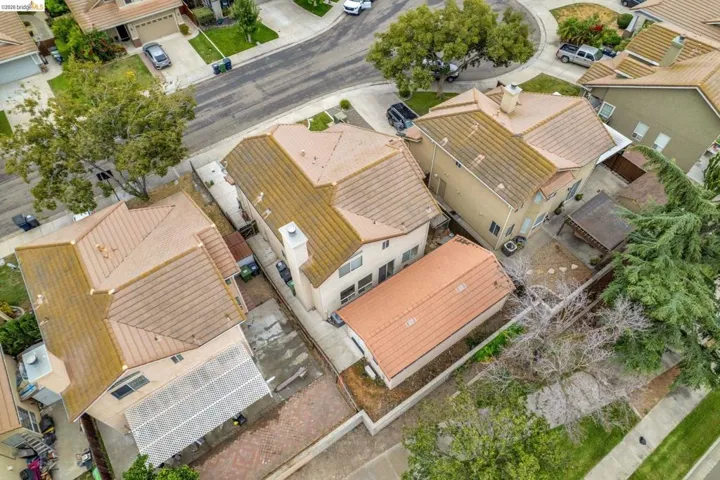 Residential property featuring a tile roof, stucco exterior, and attached garage
