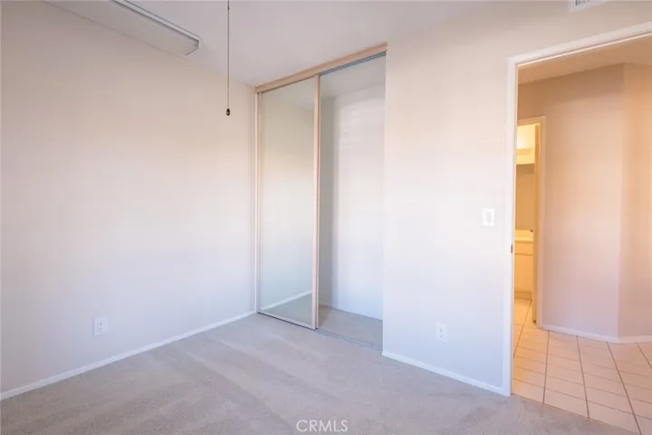 Mirrored bedroom closet doors.