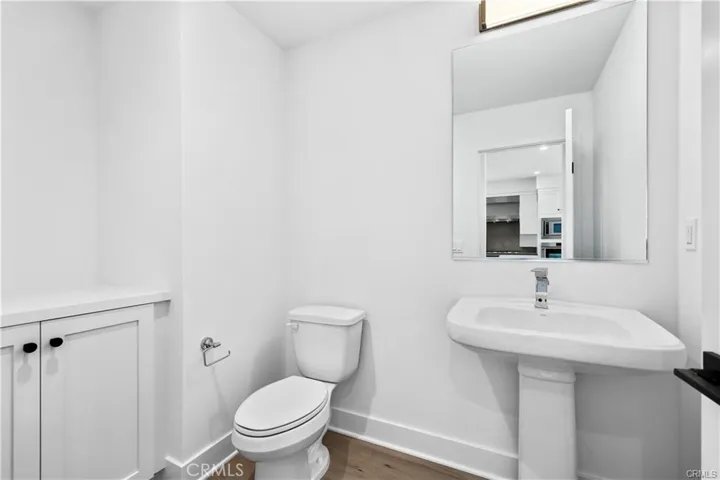 Powder room is located off the kitchen & living room.