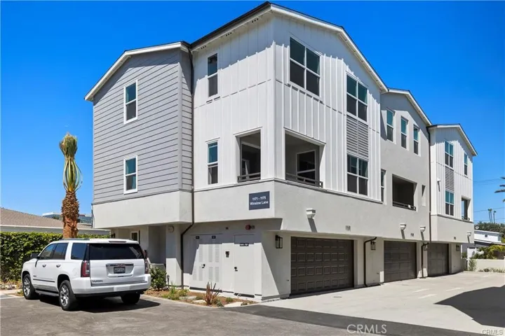 Here is the full view of the unit, located on an inside location, with a 2 car attached garage.