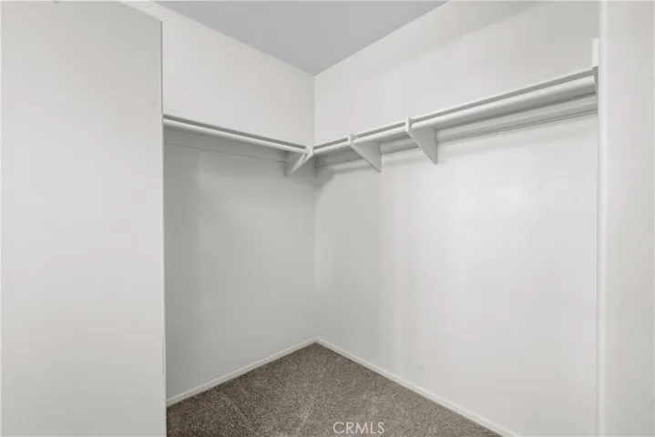 A portion of the walk-in closet in the primary bedroom.