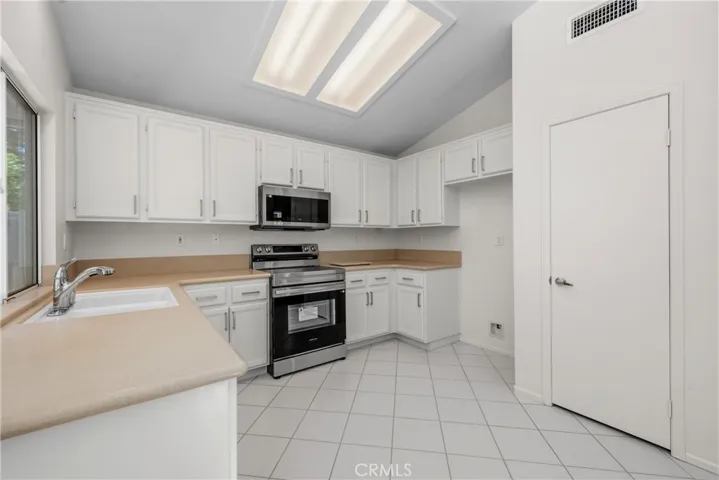 The kitchen has a convenient pantry closet.