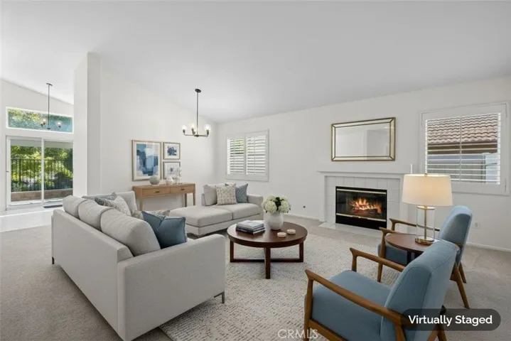 Light & bright living & dining area with cozy fireplace!