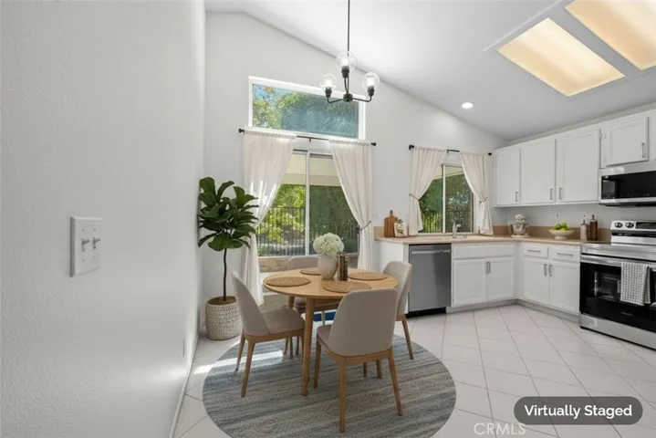 The kitchen features all new stainless steel appliances and extra room for a breakfast table.