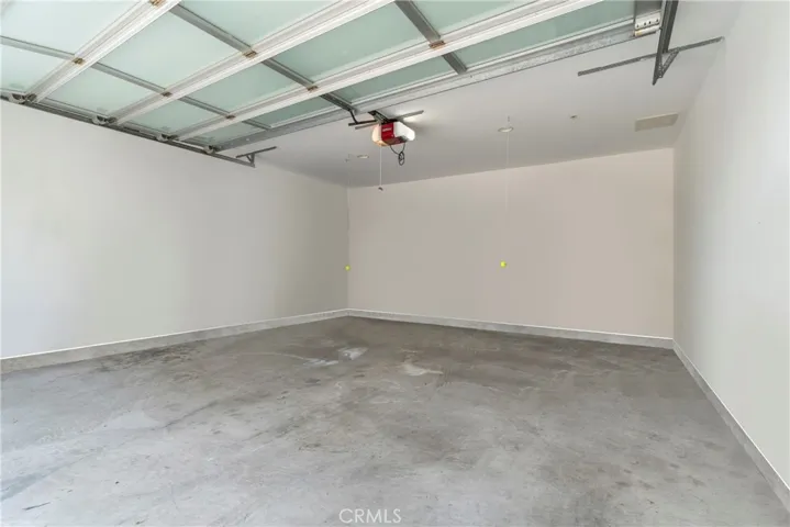 The garage has been virtually decluttered; personal items were digitally removed.