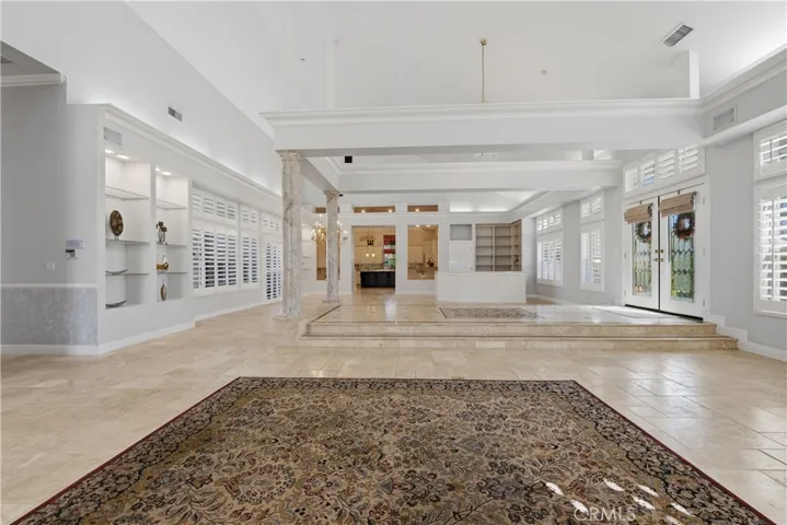 Formal Living/Great Great Room Overlooking Into the Dining, Family Room, and the Kitchen