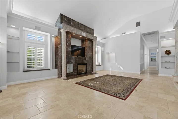 Great Room With Many Custom Built-in Shelves