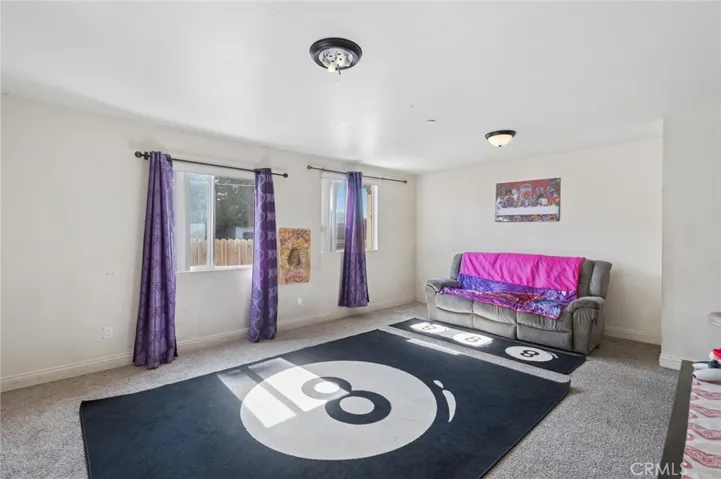 On the first floor is living, dining, kitchen, bedroom & full bath