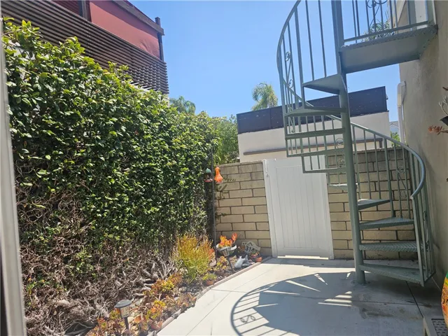 Backyard showing spiral staircase to the lanai