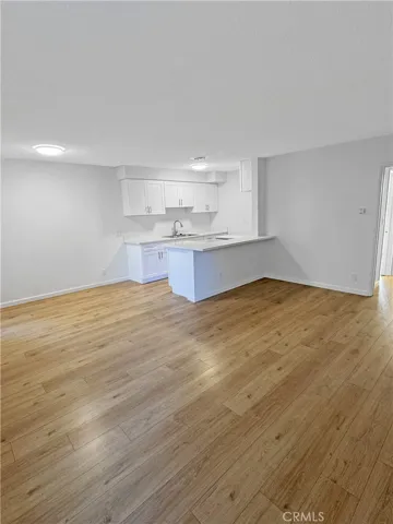 Woodlike flooring throughout