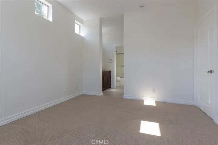 Primary suite with walk-in closet and bathroom attached.