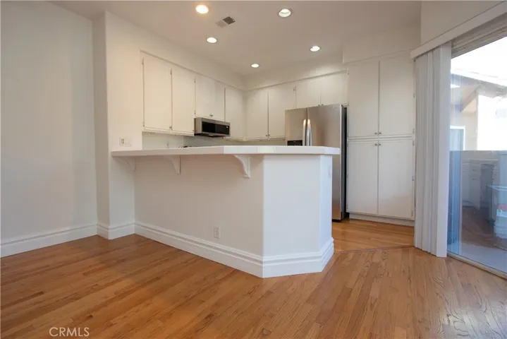 Pantry cupboards and recessed lighting in the kitchen.