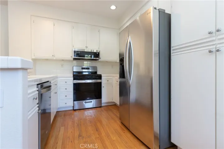 Efficient kitchen with ample cupboards and counter space.