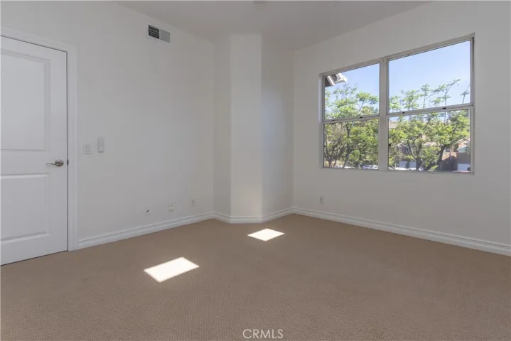 Lovely natural light in the primary suite.