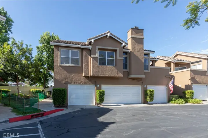 Second story, single level condo with garage and balcony.