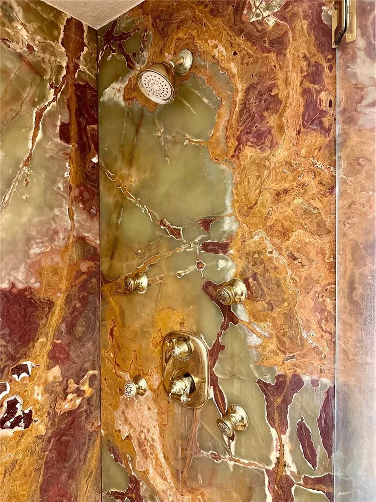 Onyx stone walls, body sprayers and showerhead