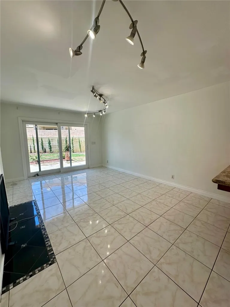 Family room with sliding door access to the oversized backyard
