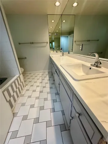 Newly updated hallway bathroom. Double sink and bathtub