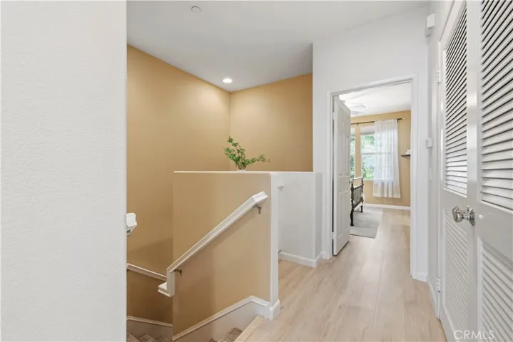 upstairs landing with laundry and storage