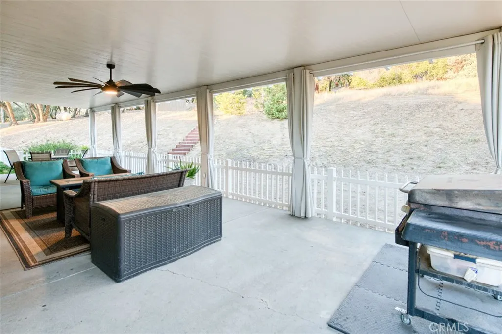 Generous covered back porch designed for year-round outdoor dining, barbecues, and enjoying the peaceful mountain air.
