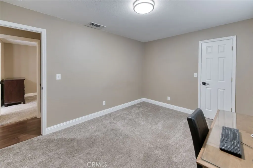  Versatile bedroom space perfectly suited for a quiet home office, gym, or hobby room with clean finishes.