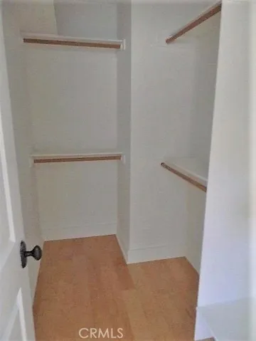Walk-in closet in primary bedroom