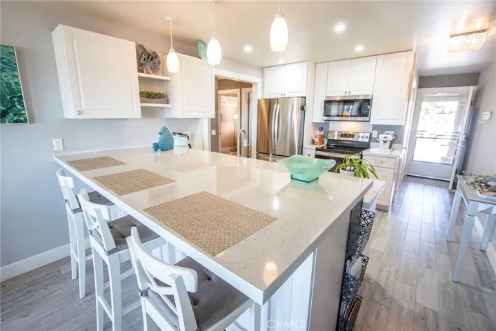 Beautifully updated kitchen featuring an open-concept design that flows seamlessly into the living room, perfect for entertaining.