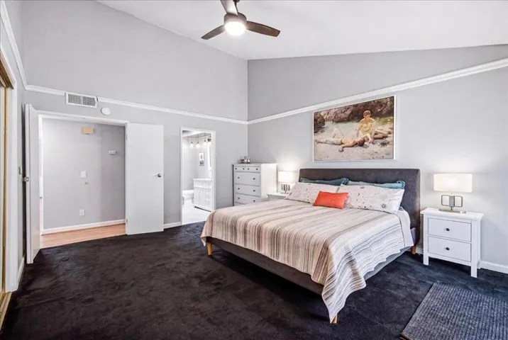 Primary bedroom w vaulted ceilings